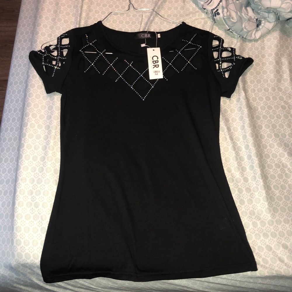 black shirt with sequins and cut outs
